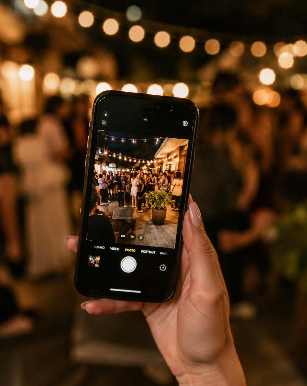 A guest taking a photo on a phone